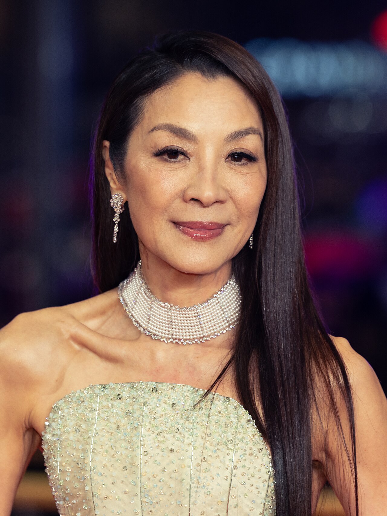 Michelle Yeoh as Evelyn Wang mid-leap in a multiverse fight sequence from Everything Everywhere All at Once